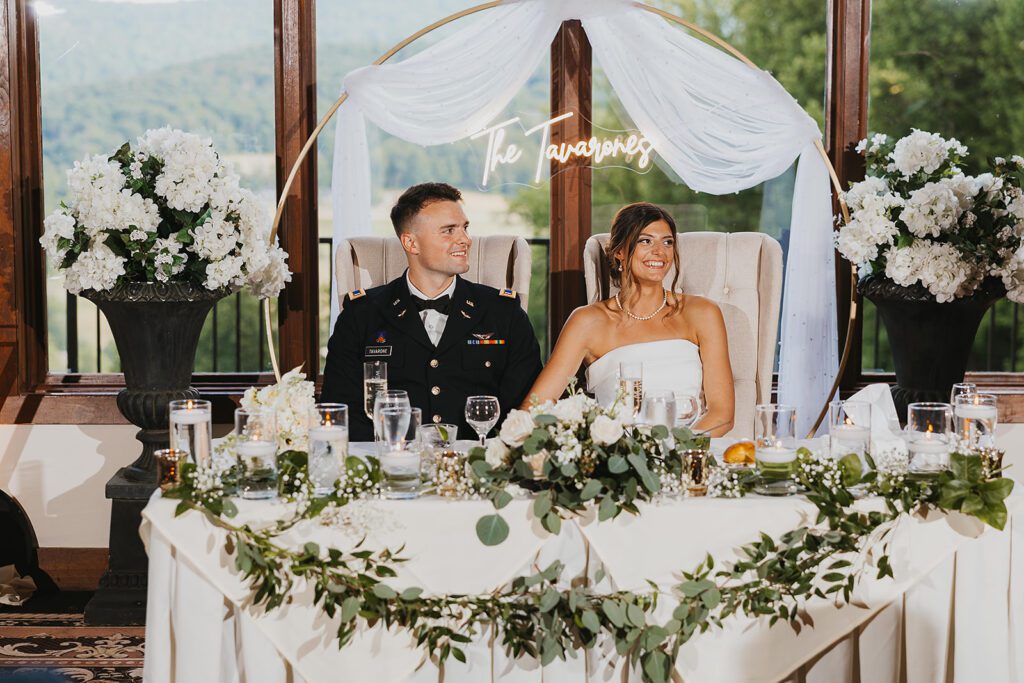 the newlyweds sitting at their sweethearts table