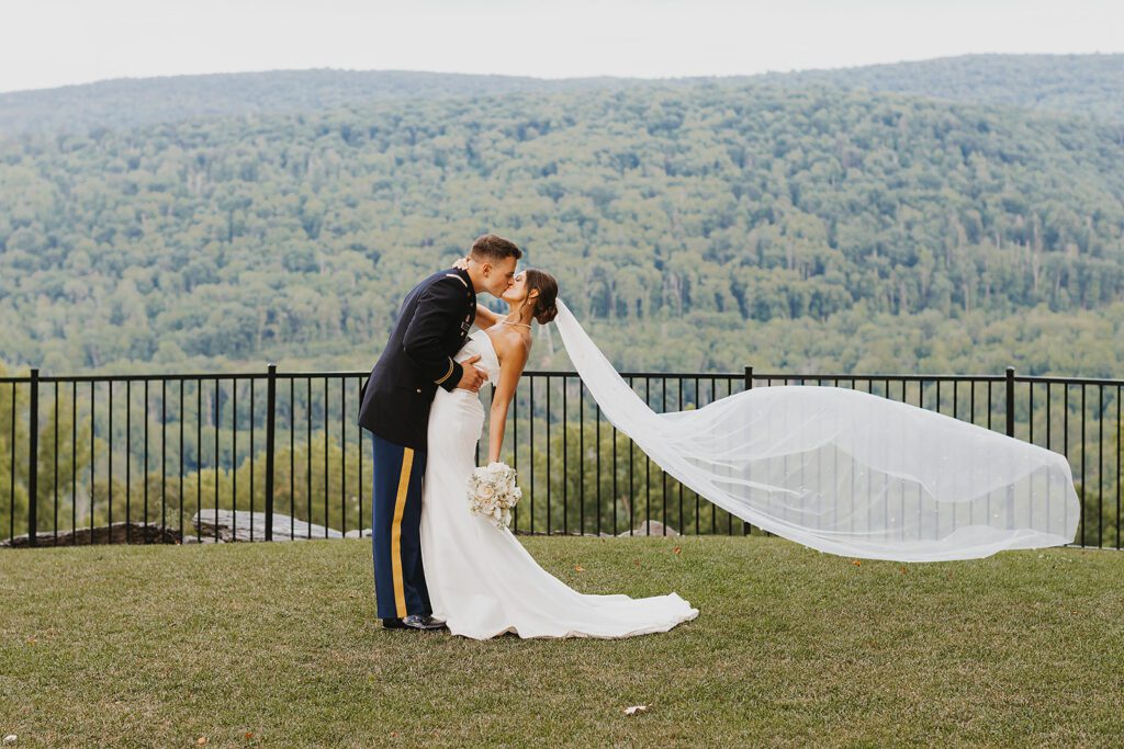 candid bride and groom photos during Stroudsmoor Country Inn wedding, groom is wearing his military uniform