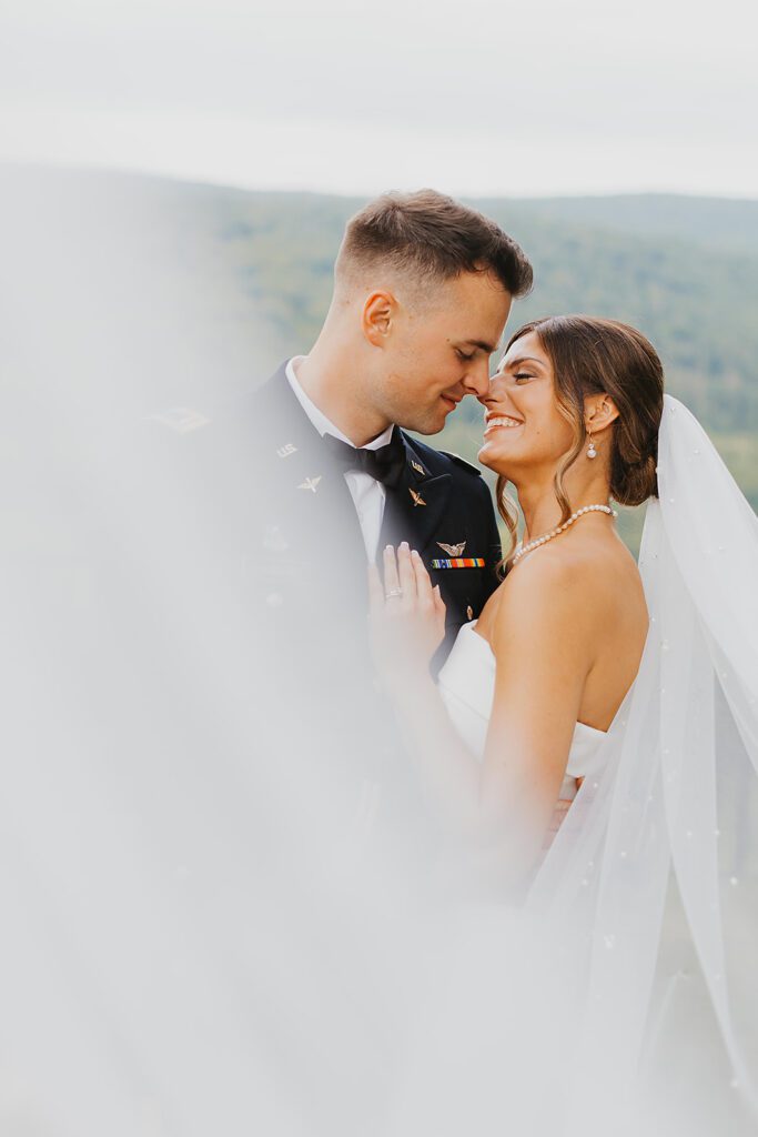 candid bride and groom photos during Stroudsmoor Country Inn wedding, groom is wearing his military uniform