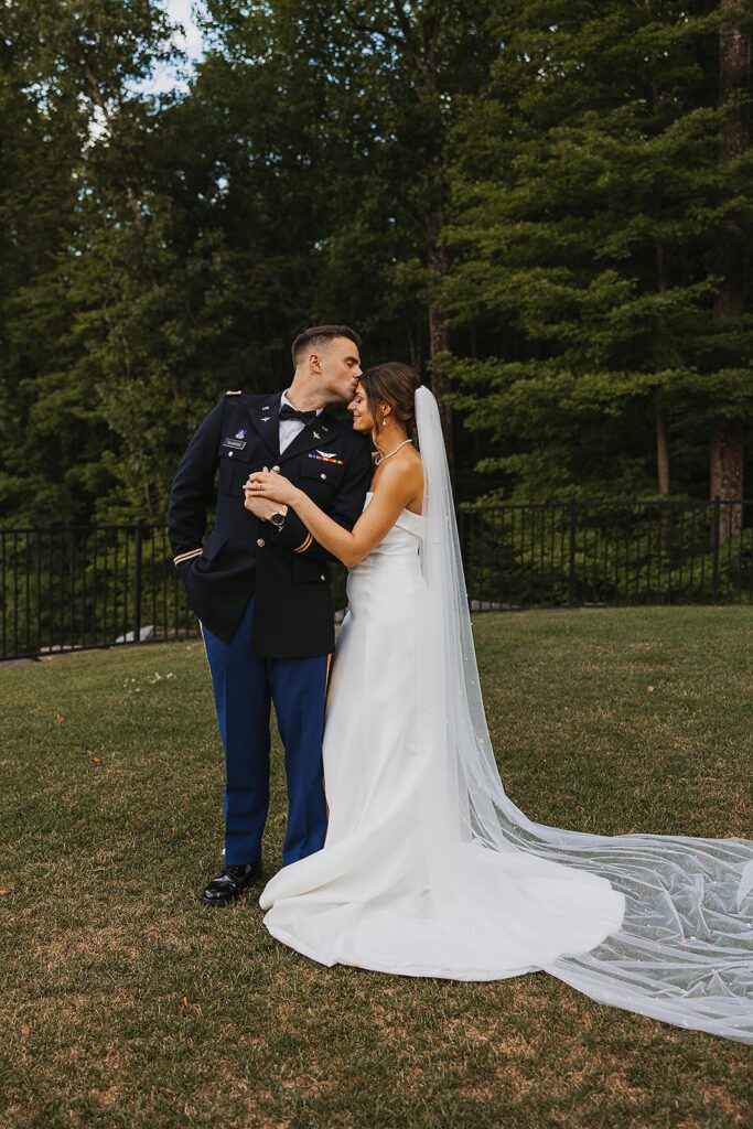 candid bride and groom photos during Stroudsmoor Country Inn wedding, groom is wearing his military uniform