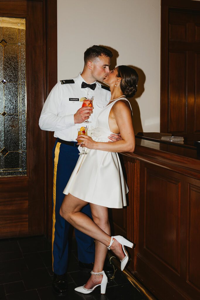 bride and groom kissing in a bar area of the Stroudsmoor Country Inn